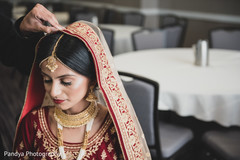 Indian bride getting her Gorgeous Ghoonghat on. Indian bride getting her Gorgeous Ghoonghat on.