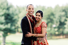 Maharani and Raja smiling during the outdoors photo shoot Maharani and Raja smiling during the outdoors photo shoot