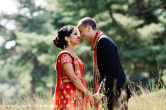 Indian lovebirds have a tender moment during the photo shoot Indian lovebirds have a tender moment during the photo shoot