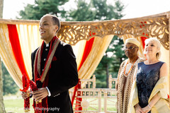 Raja holding the flower garland during the ceremony Raja holding the flower garland during the ceremony