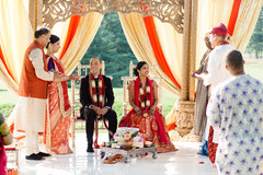 Joyful Indian couple smiling as the ceremony continues Joyful Indian couple smiling as the ceremony continues