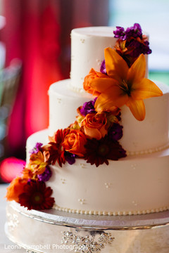 Close up detail of the delicious Indian wedding cake and flowers Close up detail of the delicious Indian wedding cake and flowers