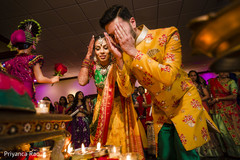 Indian bride and groom making offerings to gods. Indian bride and groom making offerings to gods.