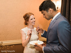 Indian couple tasting their wedding cake Indian couple tasting their wedding cake