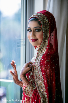 Indian bride staring at the camera prior to the ceremony Indian bride staring at the camera prior to the ceremony