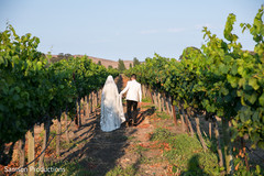 Indian newlyweds walking in a vineyard Indian newlyweds walking in a vineyard