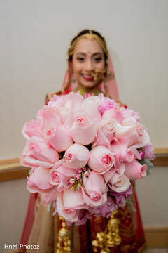 Lovely indian bride showing her floral bouquet Lovely indian bride showing her floral bouquet