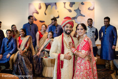 Bridal party admiring indian couple Bridal party admiring indian couple