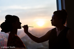 Indian bride getting the last touch ups. Indian bride getting the last touch ups.