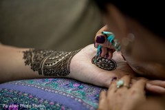 Mehndi artist working on maharani's design Mehndi artist working on maharani's design