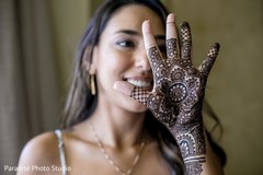 Beautiful Indian bride showing her mehndi design Beautiful Indian bride showing her mehndi design