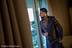 Charming Indian groom getting ready scene Charming Indian groom getting ready scene