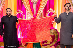 Indian bride being corver at her mehndi party. Indian bride being corver at her mehndi party.