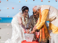 Indian bride and groom liting up sacred fire. Indian bride and groom liting up sacred fire.