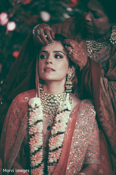 Maharani getting the red dot on forehead. Maharani getting the red dot on forehead.