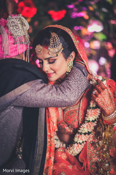 Indian groom putting a necklace to bride during the ceremony ritual. Indian groom putting a necklace to bride during the ceremony ritual.