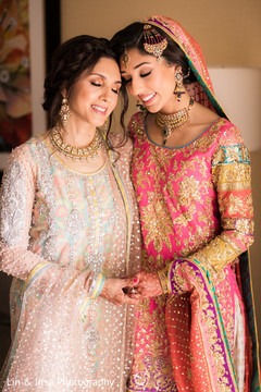 Striking capture of the Indian bride and her mother as they get ready Striking capture of the Indian bride and her mother as they get ready