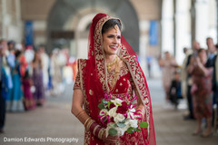 Beautiful Indian bride holding the bouquet prior to the ceremony Beautiful Indian bride holding the bouquet prior to the ceremony