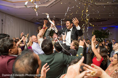 Indian wedding guests cheering for the newlyweds Indian wedding guests cheering for the newlyweds