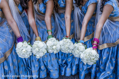 Indian bridesmaids pose for pictures with the bouquets Indian bridesmaids pose for pictures with the bouquets