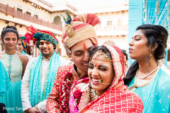 Tender moment between Indian bride and groom outdoors Tender moment between Indian bride and groom outdoors