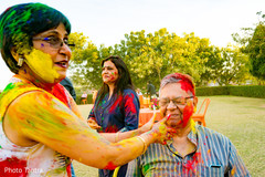 Indian wedding guests having fun during the haldi ceremonies Indian wedding guests having fun during the haldi ceremonies