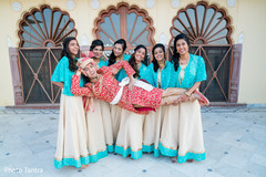 Fun capture of beautiful bridesmaids holding the raja Fun capture of beautiful bridesmaids holding the raja