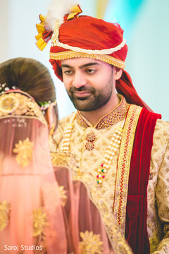 Indian bride and groom first look scene. Indian bride and groom first look scene.