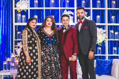 Indian bride and groom posing with family members. Indian bride and groom posing with family members.