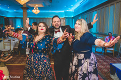 Upbeat Indian bride with guests dancing. Upbeat Indian bride with guests dancing.