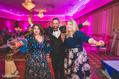 Indian bride with wedding guests rocking the dance floor. Indian bride with wedding guests rocking the dance floor.