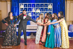 Fun capture of Indian bride and groom with bridesmaids. Fun capture of Indian bride and groom with bridesmaids.