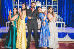 Indian groom with bridesmaids James Bond look photo. Indian groom with bridesmaids James Bond look photo.