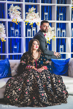 Ravishing Indian bride and groom at reception stage capture. Ravishing Indian bride and groom at reception stage capture.