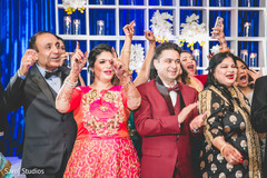 Cheerful guest welcoming Indian bide and groom capture. Cheerful guest welcoming Indian bide and groom capture.