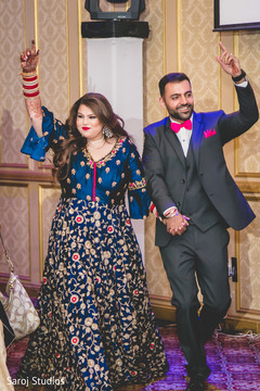 Ravishing Indian bride and groom entrance to wedding reception. Ravishing Indian bride and groom entrance to wedding reception.