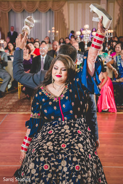 Indian bride and groom playing a shoe game. Indian bride and groom playing a shoe game.