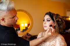 Maharani being assisted by makeup artist Maharani being assisted by makeup artist