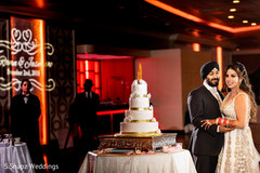 Maharani and raja next to the wedding cake Maharani and raja next to the wedding cake