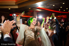 Guests dancing to the music at the fun party Guests dancing to the music at the fun party