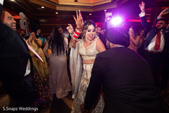 Maharani showing her mehndi design while dancing at the reception Maharani showing her mehndi design while dancing at the reception