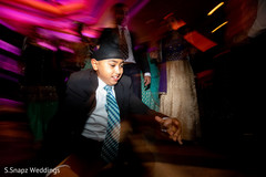 Little guest stylish dancing at the reception venue Little guest stylish dancing at the reception venue