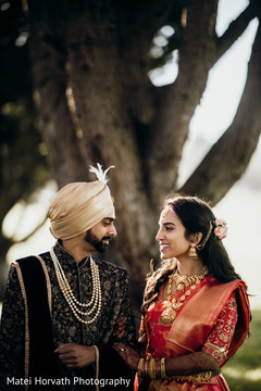 Sweet Indian bride's and groom's first look scene. Sweet Indian bride's and groom's first look scene.