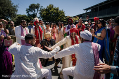 Indian groomsmen dance at the baraat celebration. Indian groomsmen dance at the baraat celebration.