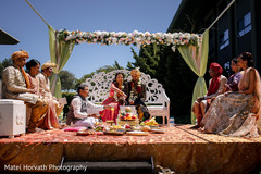 Indian bride and groom throwing the rice to sacred fire. Indian bride and groom throwing the rice to sacred fire.