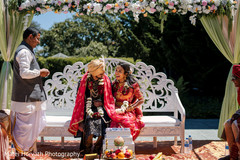 Indian bride and groom in front of sacred fire. Indian bride and groom in front of sacred fire.