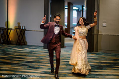 Indian newlyweds making their entrance to wedding reception Indian newlyweds making their entrance to wedding reception