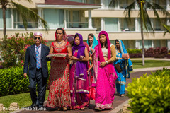 Indian bride walking in with father and bridesmaids. Indian bride walking in with father and bridesmaids.
