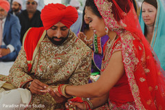 Sweet Indian couple exchanging rings. Sweet Indian couple exchanging rings.
