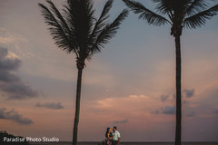 Stunning capture of indian bride and groom by the beach. Stunning capture of indian bride and groom by the beach.